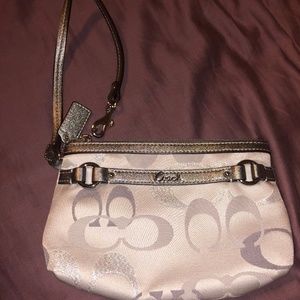never used white and silver coach wristlet